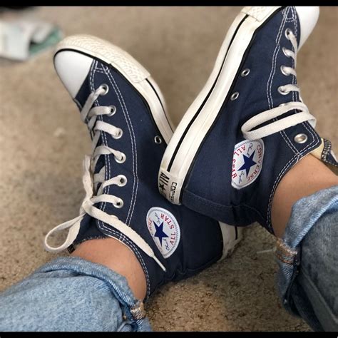 navy blue high top sneakers.